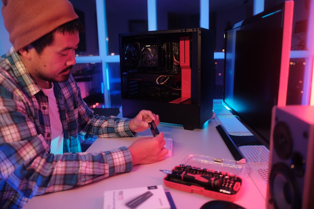 Computer Hardware Troubleshooting cover with a desktop tower, laptop, RAM stick, power cable, and screwdriver on a clean desk
