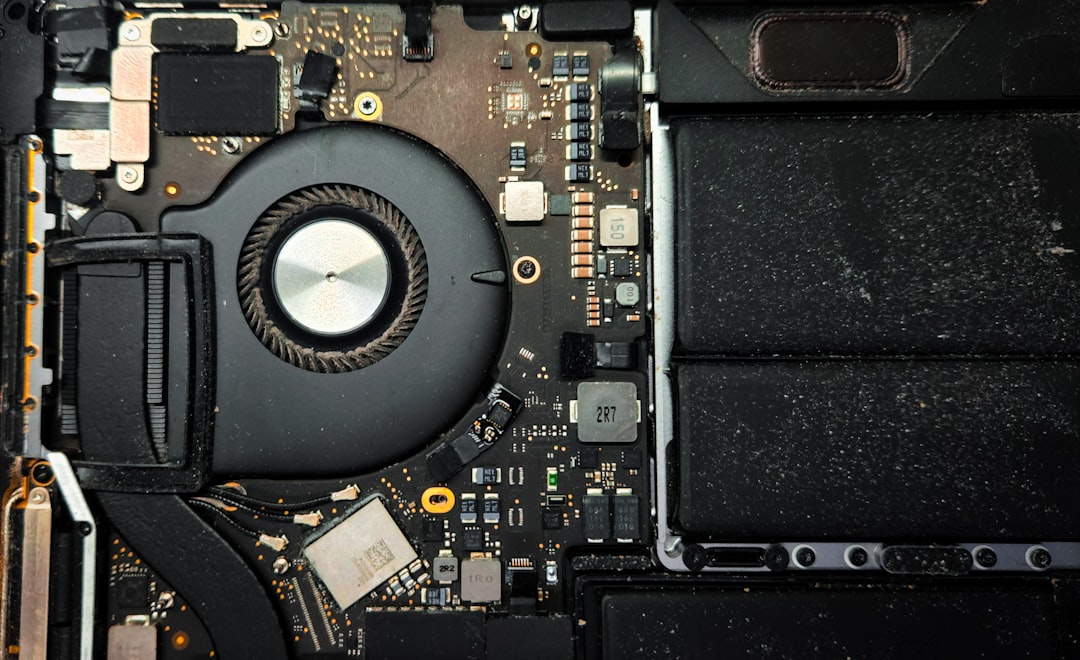 laptop overheating repair tips cover showing a dusty notebook, cooling fan, thermal paste tube, and airflow arrows